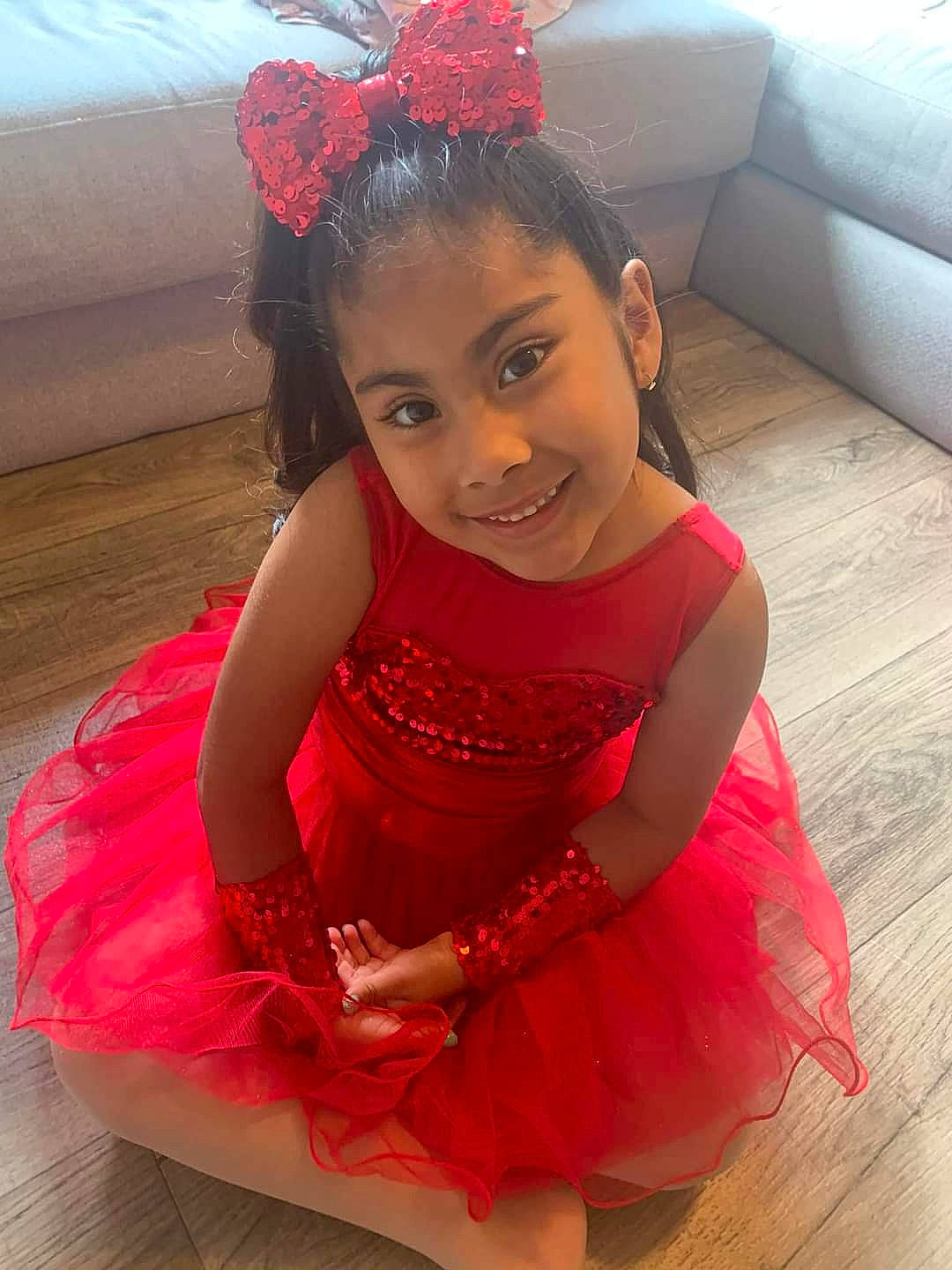 Inaya is registered to the contest to win money with this photo: baby_toddler_clothing, beauty, dress, embellishment, face, facial_expression, flower, fun, hair, hairstyle, happy, head, headpiece, joy, long_hair, magenta, person, pink, red, skin