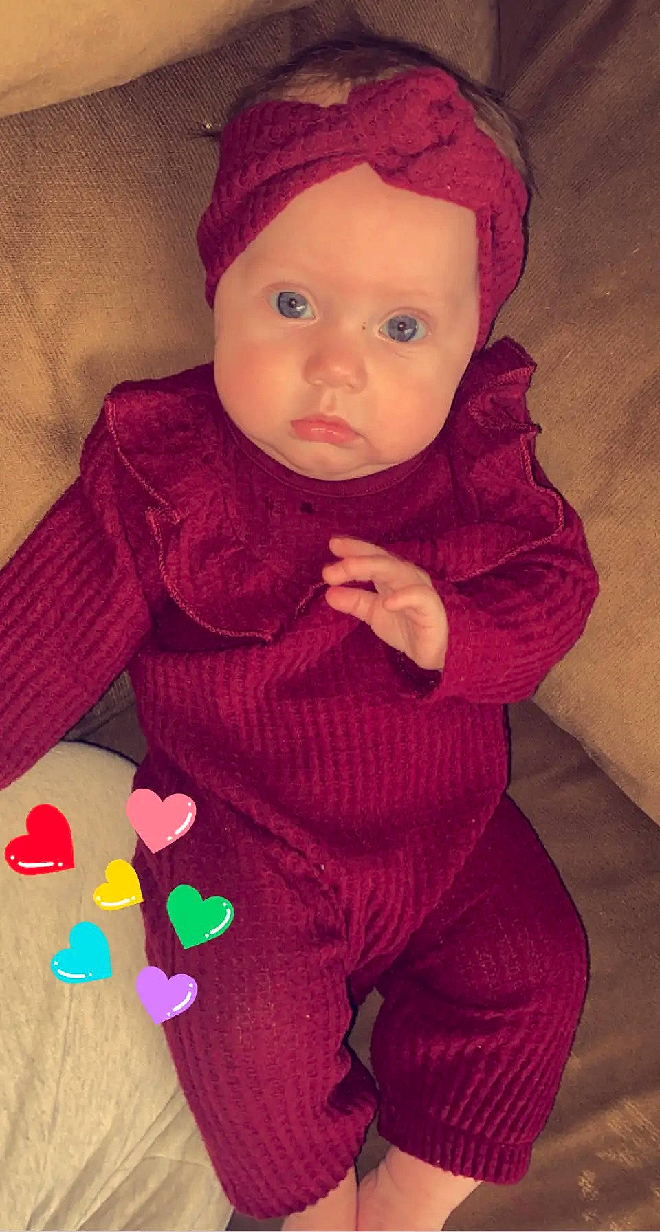 Rylee is registered to the contest to win money with this photo: baby, baby_toddler_clothing, cap, cheek, child, eye, finger, head, headwear, lip, magenta, nose, outerwear, pattern, person, pink, purple, red, skin, sleeve