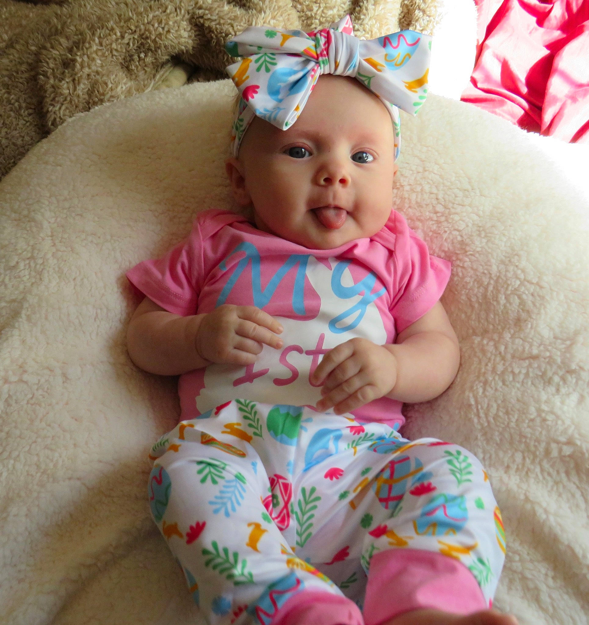 Aubree joined the competition — help win amazing prizes! baby, baby_toddler_clothing, cap, cheek, child, comfort, doll, dress, facial_expression, happy, hat, headband, headgear, headwear, leg, linens, person, pink, skin, sleeve