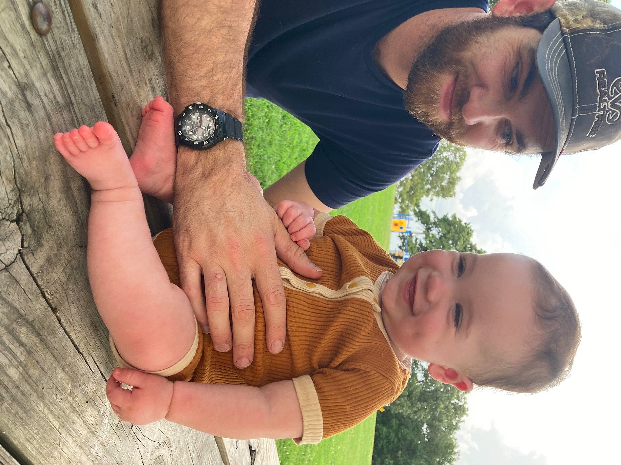 Canyon is registered to the contest to win money with this photo: arm, face, finger, gesture, grass, green, hand, happy, headwear, human, joint, joy, leaf, leisure, organ, people_in_nature, person, photograph, plant, red