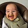 baby, high_chair, bib, food, messy, smiling, happy, face, infant, feeding, child, clothing, indoor, portrait, cute, tongue, skin, seat, mealtime, expression