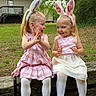 bunny_ears, child, cute, easter, footwear, friendship, girl, grass, happy, house, nature, outdoor, pink_dress, playful, portrait, smiling, spring, tree, white_tights, wooden_log