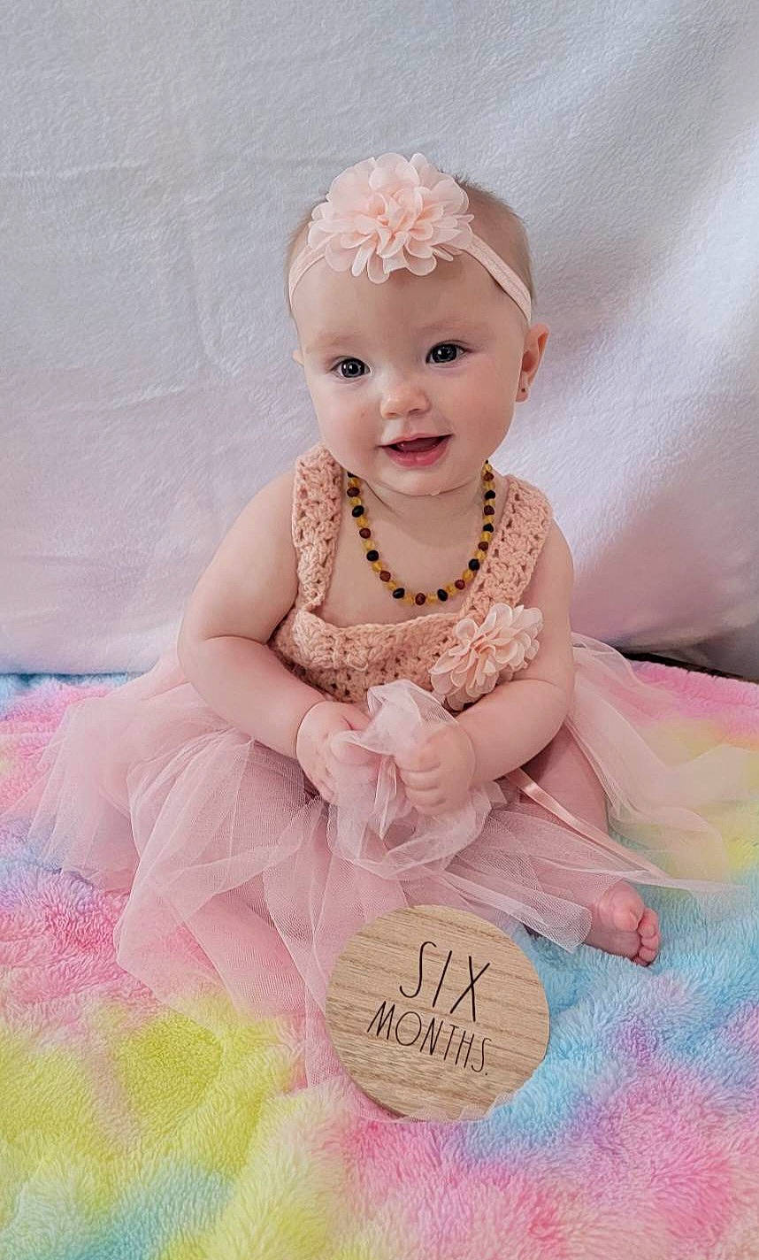 Kylie joined the competition — help win amazing prizes! baby, baby_toddler_clothing, child, day_dress, dress, embellishment, fashion_accessory, flash_photography, happy, headpiece, jewellery, magenta, pattern, peach, person, pink, product, skin, sleeve, smile
