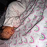 Jream joined the competition — help win amazing prizes! baby, sleeping, pajamas, elephant_pattern, blanket, rainbow_pattern, bedtime, infant, cute, cozy, child, resting, soft, indoors, portrait, peaceful, toddler, clothing, face, sleep