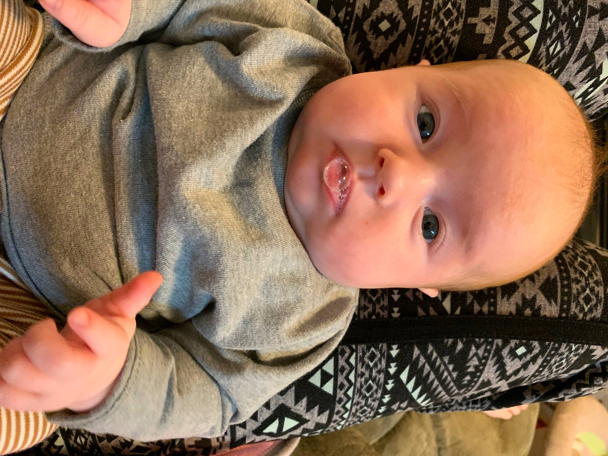 June is registered to the contest to win money with this photo: baby, baby_toddler_clothing, cheek, child, chin, comfort, finger, gesture, hand, iris, lip, mammal, nose, people, person, skin, sleeve, textile, toddler, vertebrate