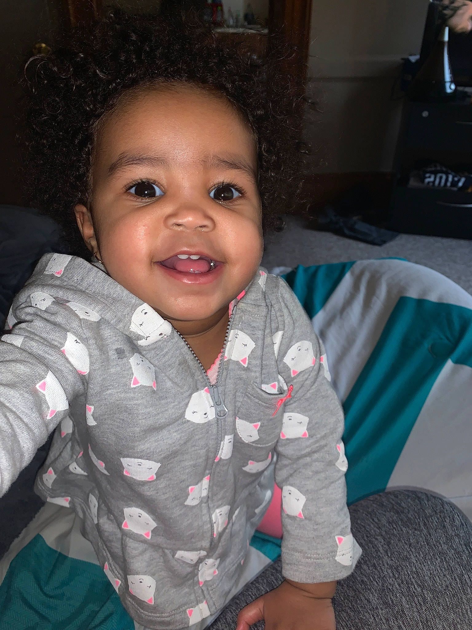 Erykah is registered to the contest to win money with this photo: baby, cheek, child, chin, eye, face, facial_expression, forehead, fun, happy, head, iris, joy, lip, nose, people, person, sitting, skin, smile