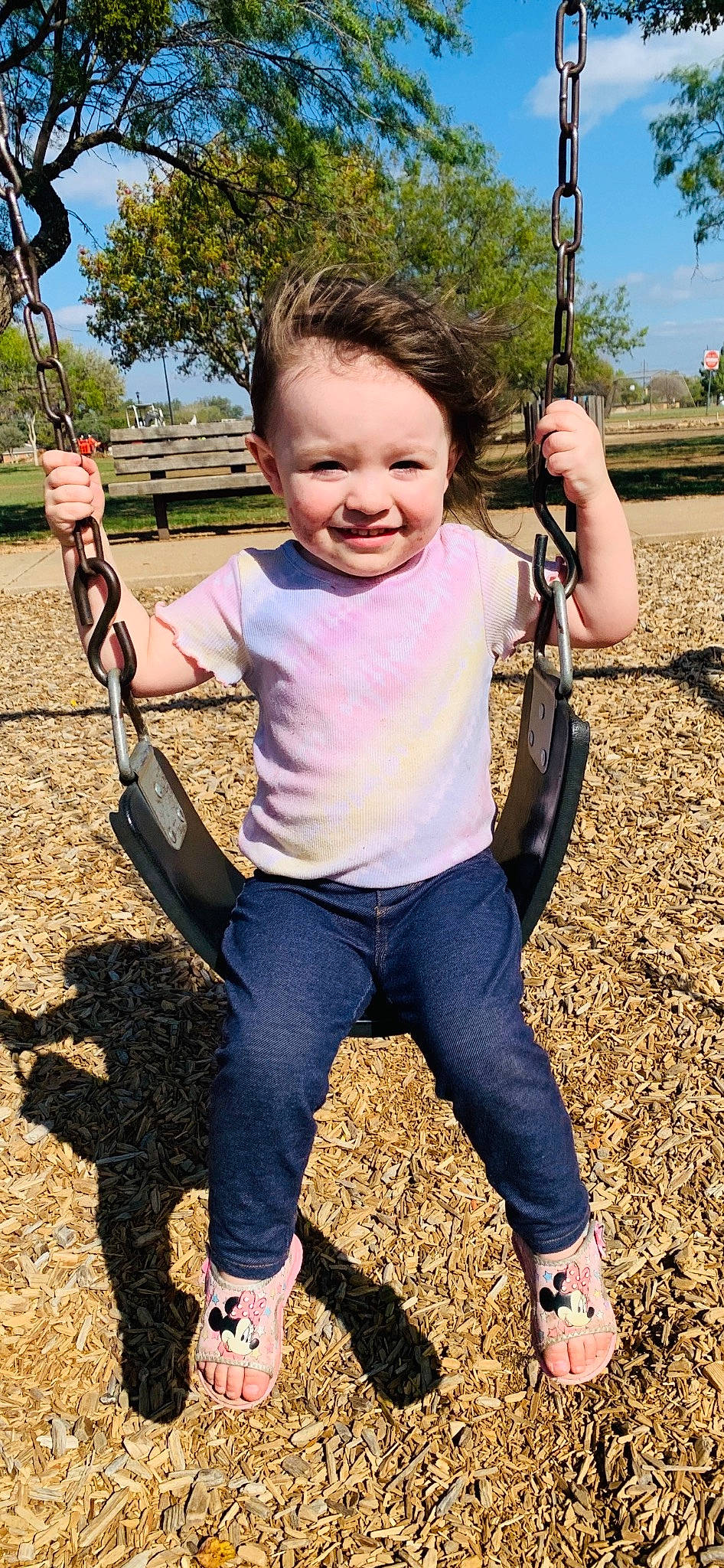 Hanna joined the competition — help win amazing prizes! baby_toddler_clothing, child, eye, facial_expression, fun, grass, hairstyle, happy, joy, leisure, people_in_nature, person, plant, playground, recreation, sitting, sky, smile, swing, t_shirt