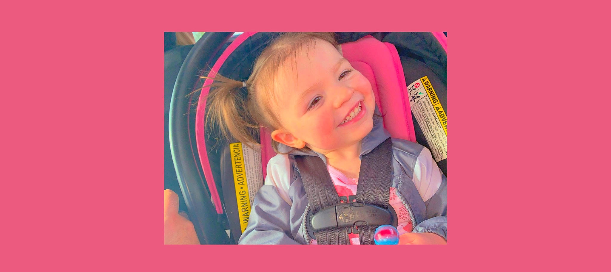 Hanna is registered to the contest to win money with this photo: auto_part, baby_carriage, baby_products, car_seat, child, electric_blue, fashion_accessory, fun, happy, joy, laugh, magenta, person, personal_protective_equipment, recreation, room, sleeve, smile, toddler, travel