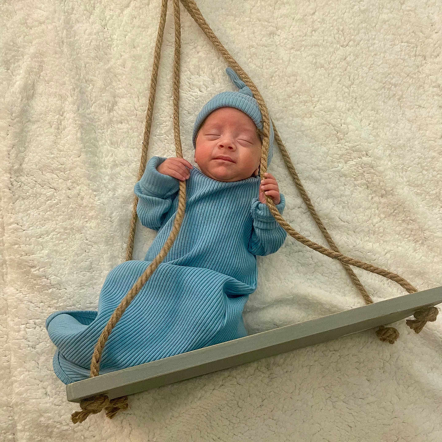 Zion joined the competition — help win amazing prizes! baby, bed, blade, clothing, dagger, face, furniture, happy, hat, head, knife, newborn, person, photography, playarea, portrait, sitting, swing, toy, weapon