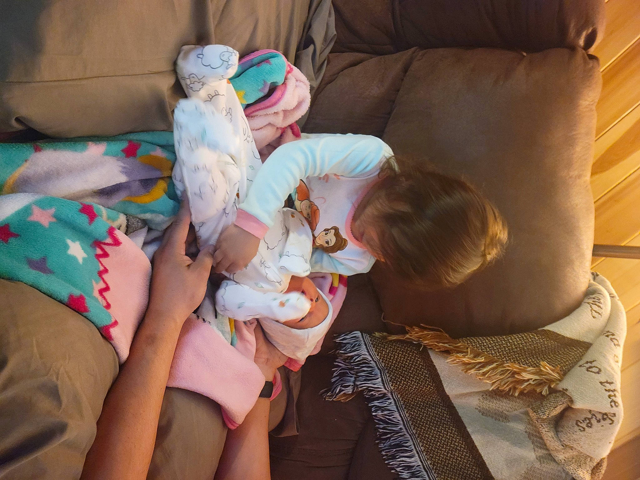 Rebecca is registered to the contest to win money with this photo: abdomen, baby, bedding, bedtime, child, comfort, couch, hat, human_leg, knee, lap, linens, nap, person, room, shorts, sitting, stuffed_toy, textile, thigh