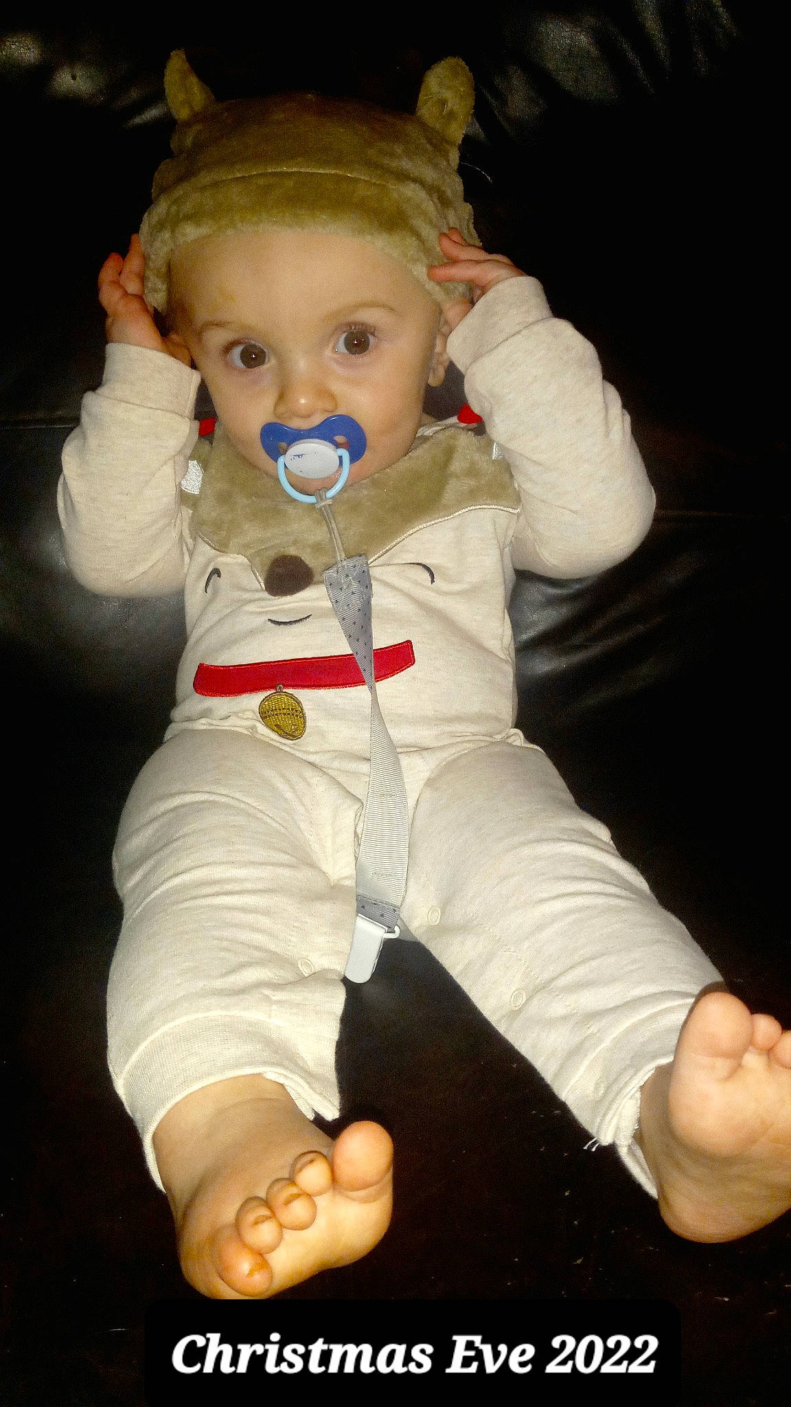 Calvin is registered to the contest to win money with this photo: baby, baby_toddler_clothing, barefoot, cheek, child, comfort, costume, fictional_character, finger, foot, fun, hand, hat, nose, person, personal_protective_equipment, sitting, sleeve, thumb, toddler