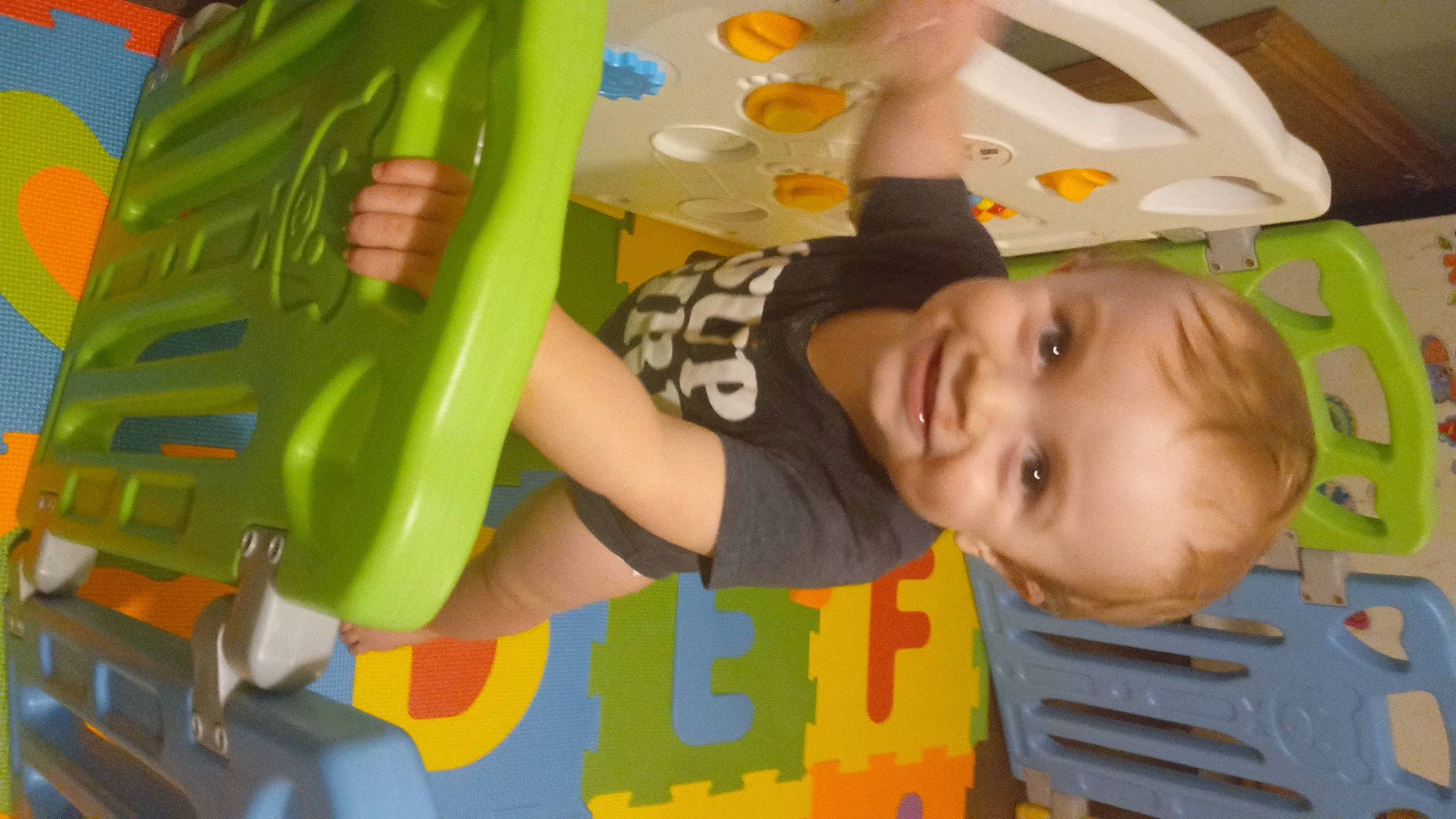 Calvin is registered to the contest to win money with this photo: baby, baby_products, baby_toddler_clothing, baby_toys, child, finger, flooring, fun, happy, joy, leisure, person, plastic, play, product, recreation, room, smile, t_shirt, toddler