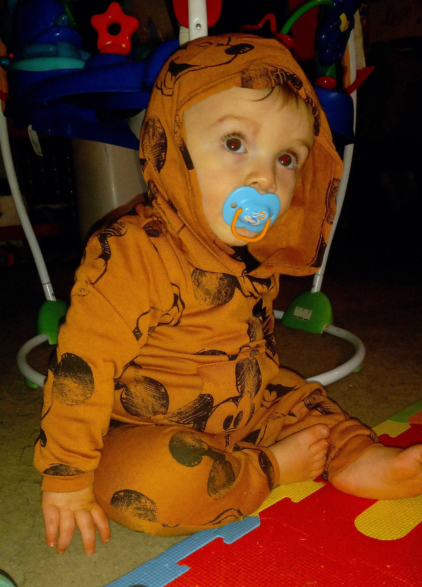 Calvin is registered to the contest to win money with this photo: baby, baby_products, baby_toddler_clothing, blue, chair, cheek, child, costume, flooring, fun, person, personal_protective_equipment, play, room, sitting, toddler, yellow