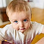 toddler, child, blue_eyes, face, curious, indoor, white_shirt, leaning, close_up, portrait, young_child, short_hair, person, cute, expression, skin, baby, head, looking, background_blur