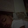 child, sleeping, indoor, pillow, window, blinds, dark, cozy, bedtime, face, peaceful, resting, person, closeup, calm, young, eyelids_closed, toddler, white_shirt, earring
