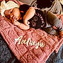 baby, bed, bedroom, blanket, clothing, couch, cushion, face, furniture, head, homedecor, indoors, newborn, person, photography, portrait, quilt, room, sleeping, t_shirt