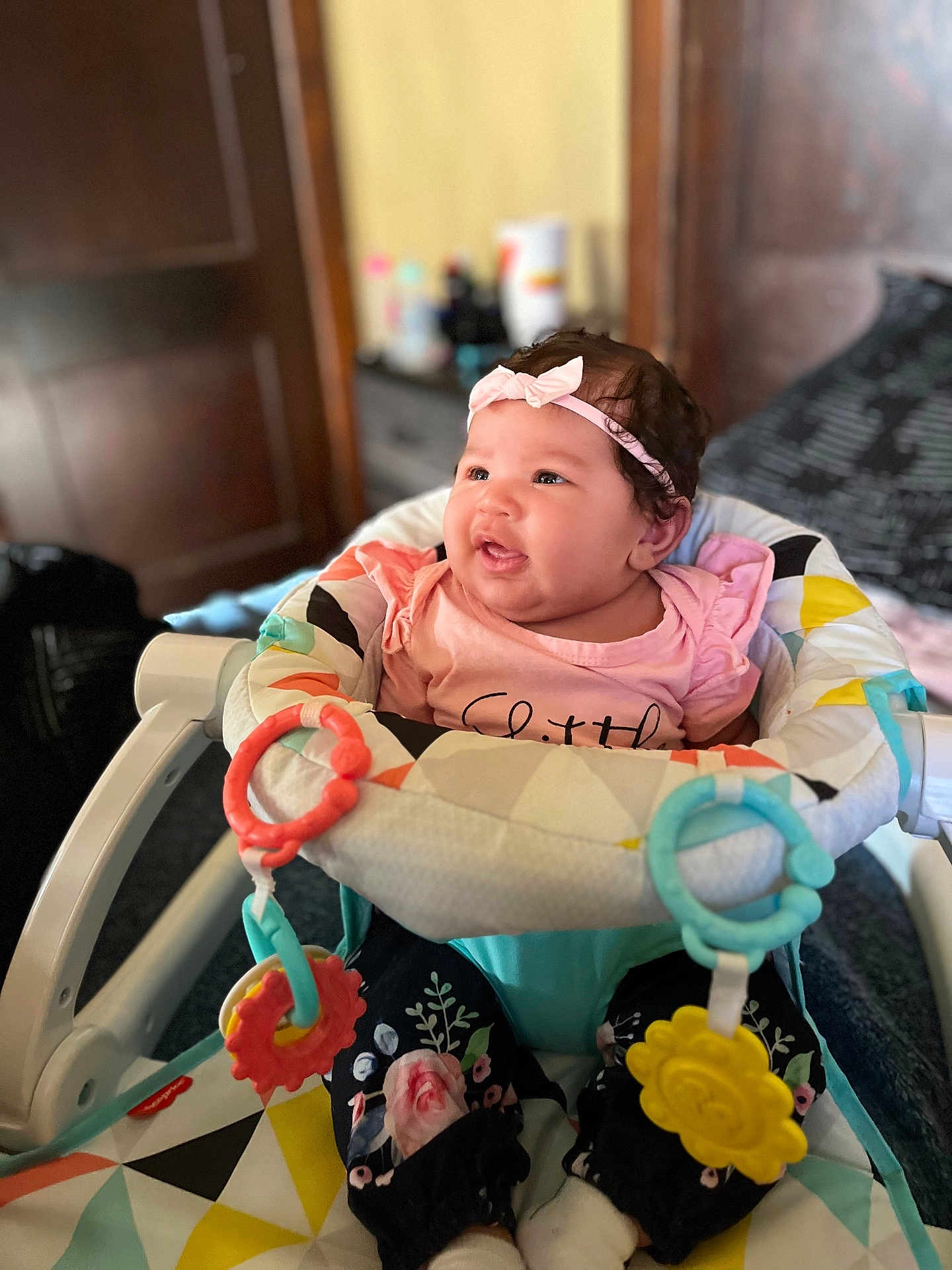 Aaliayh is registered to the contest to win money with this photo: accessories, baby, clothing, couch, cushion, face, furniture, happy, hat, head, homedecor, laughing, newborn, person, photography, portrait, sitting, smile, t_shirt, toy