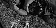 Aaliayh is registered to the contest to win money with this photo: baby, bed, bedroom, blanket, bodypart, clothing, face, finger, furniture, hand, head, indoors, newborn, person, photography, portrait, quilt, room, sleeping, t_shirt