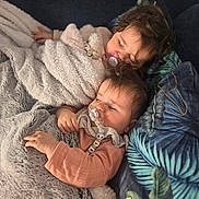 Mia Et Alba a rejoint le concours — aidez-le/la à gagner de superbes lots ! baby, toddler, sleeping, blanket, pacifier, cozy, couch, pillow, indoor, child, face, peaceful, rest, cute, naptime, soft, comfort, hair, clothing, home