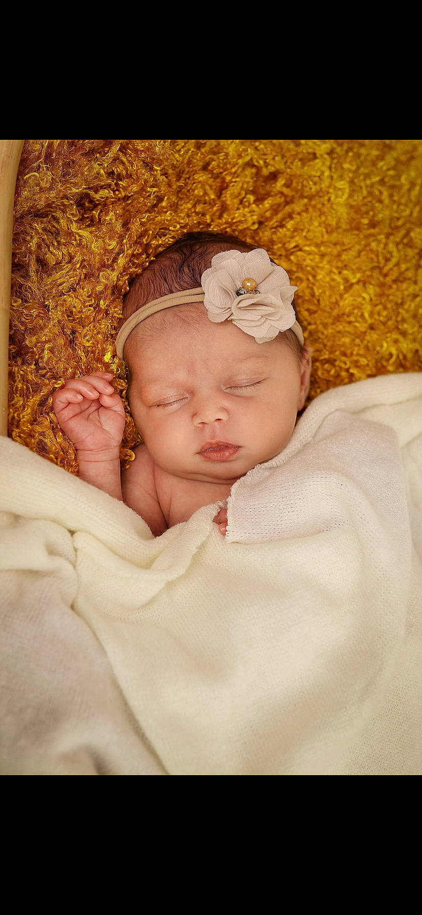 Myla participe au concours pour gagner de l'argent avec cette photo : arm, baby, baby_sleeping, baby_toddler_clothing, comfort, dress, eyelash, flower, gesture, headband, headgear, headpiece, headwear, linens, lip, nail, neck, person, skin, sleeve