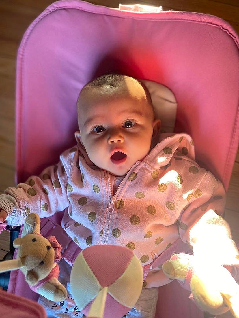 Myla participe au concours pour gagner de l'argent avec cette photo : baby, baby_products, baby_toddler_clothing, baby_toys, cheek, child, comfort, fun, happy, human_body, iris, linens, magenta, pattern, person, pink, play, purple, room, sitting