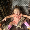 animal, brick_wall, chair, child, dog, girl, happy, iron_gate, outdoor, patio, pet, pink_outfit, pink_socks, portrait, puppy, shoes, sitting, smiling, toddler, wicker_chair