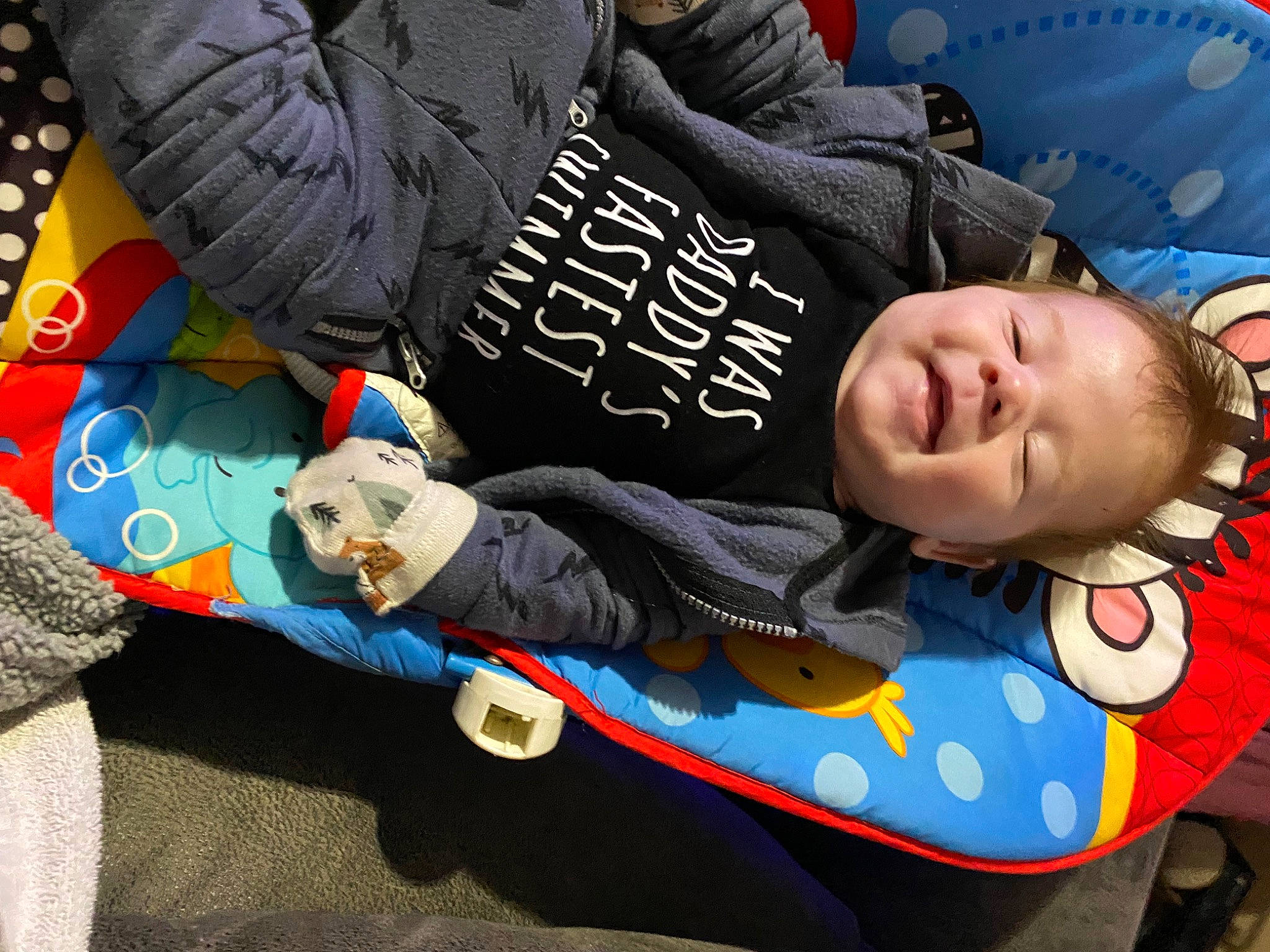 Braxton is registered to the contest to win money with this photo: baby_products, baby_toddler_clothing, child, comfort, cool, denim, electric_blue, fun, happy, hat, leisure, mechanical_fan, pattern, person, sitting, sleeve, t_shirt, toddler