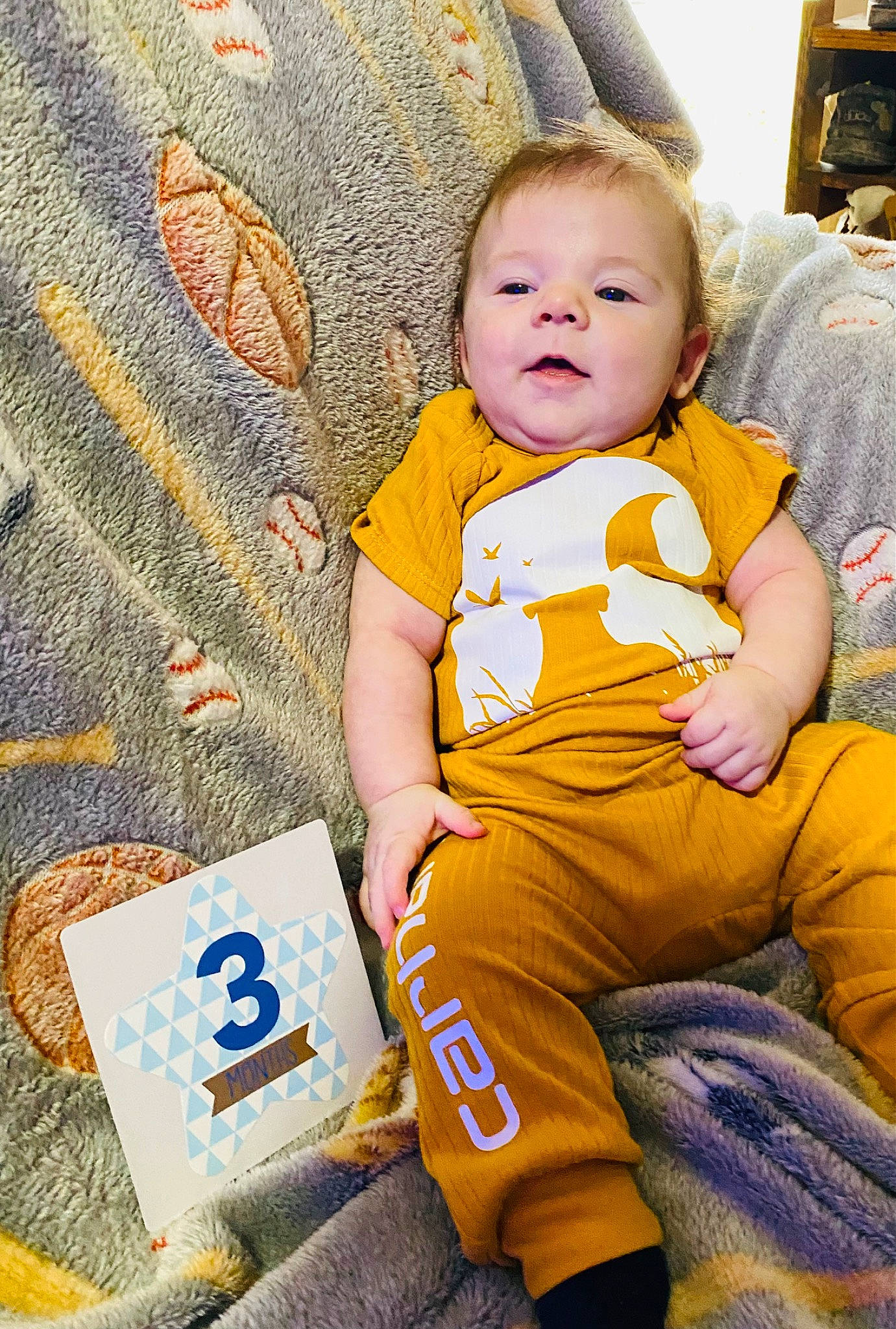 Braxton joined the competition — help win amazing prizes! baby, baby_toddler_clothing, cheek, child, eye, flooring, fun, happy, leisure, linens, orange, pajamas, pattern, person, play, sitting, skin, sleeve, smile, t_shirt