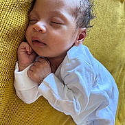 Isa Elah Raah is registered to the contest to win money with this photo: baby, sleeping, infant, white_clothing, blanket, yellow, knit, cozy, cute, peaceful, newborn, face, closed_eyes, hands, soft, portrait, resting, child, indoors, comfort