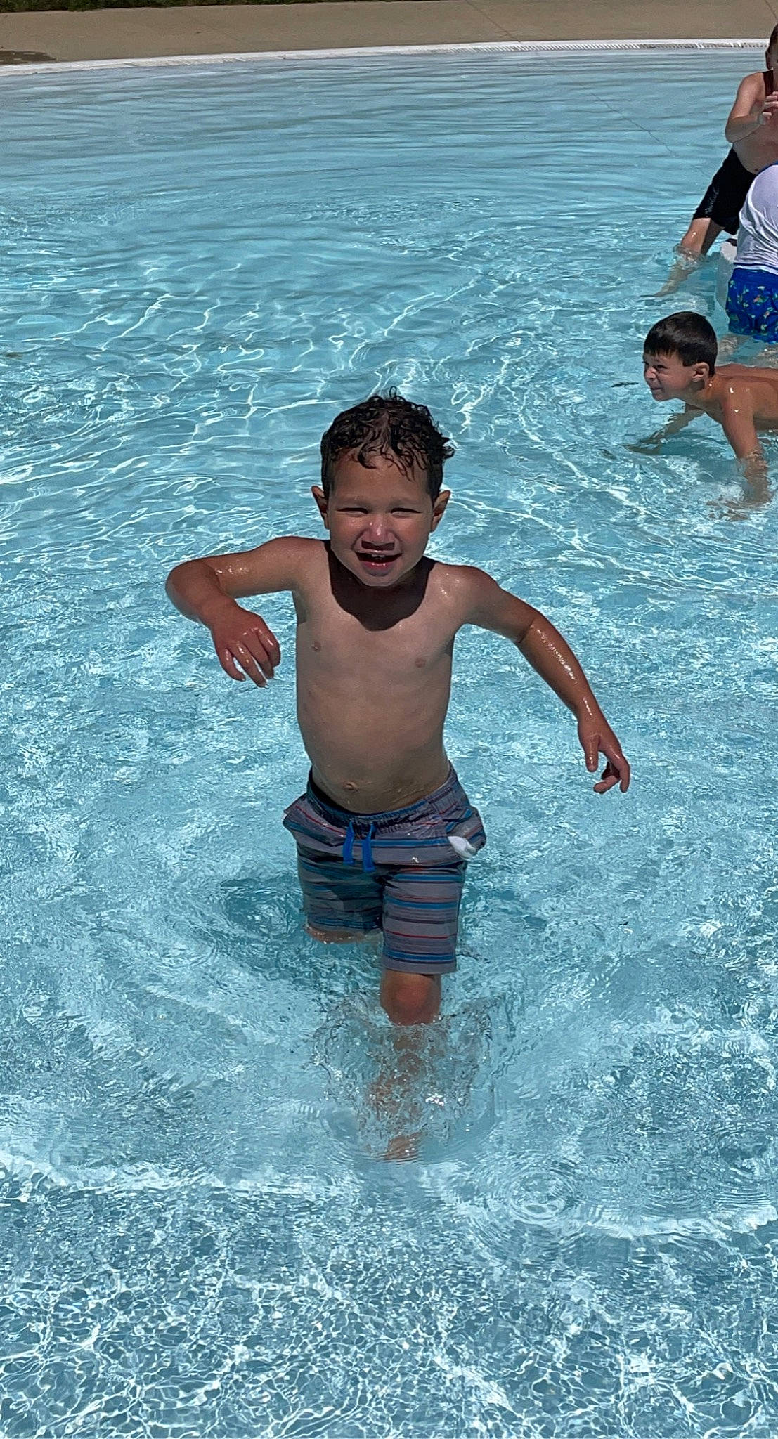 Izaiah joined the competition — help win amazing prizes! aqua, azure, barechested, barefoot, bathing, chest, face, fun, happy, leisure, leisure_centre, outdoor_recreation, people_on_beach, person, recreation, shorts, smile, swimming_pool, toddler, under_exposed