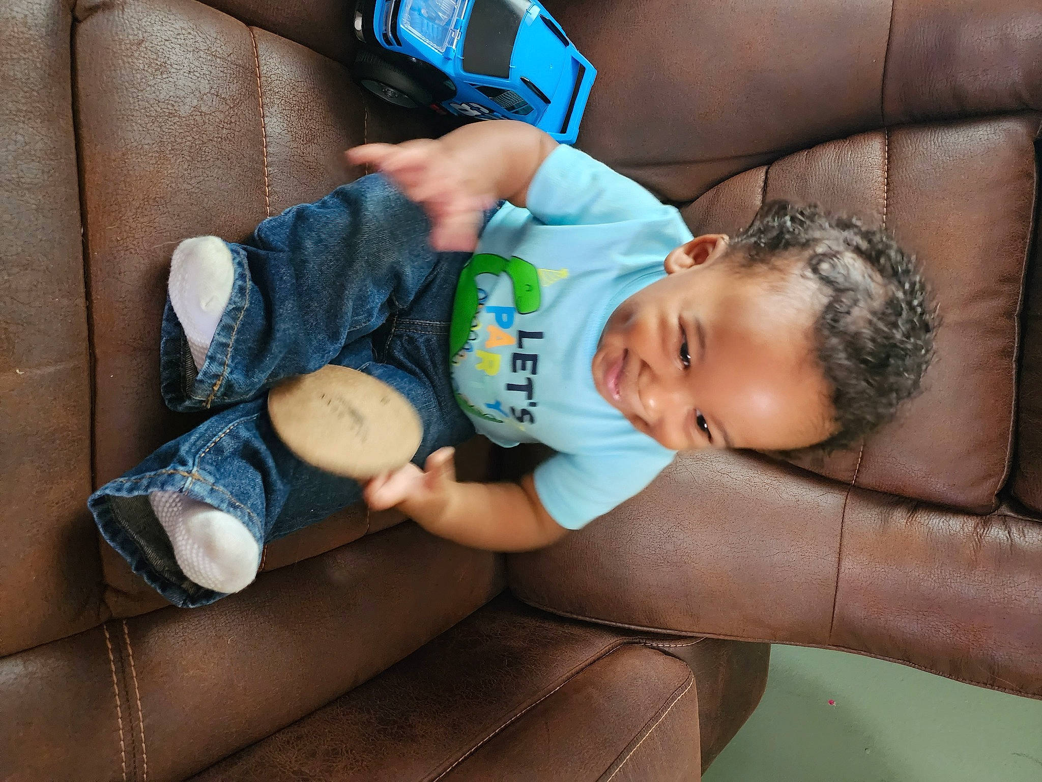 Karsyn is registered to the contest to win money with this photo: arm, baby, baby_sleeping, baby_toddler_clothing, blue, child, comfort, elbow, electric_blue, finger, hand, human_leg, joint, leg, nail, person, sitting, skin, thigh, thumb