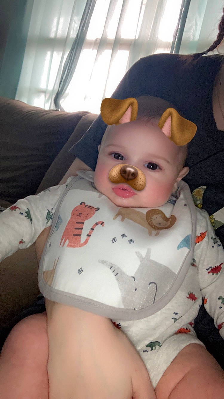 Braylynn is registered to the contest to win money with this photo: abdomen, baby, baby_toddler_clothing, cheek, chest, child, comfort, curtain, eye, fawn, fun, fur, head, headwear, human_body, human_leg, knee, pattern, person, skin