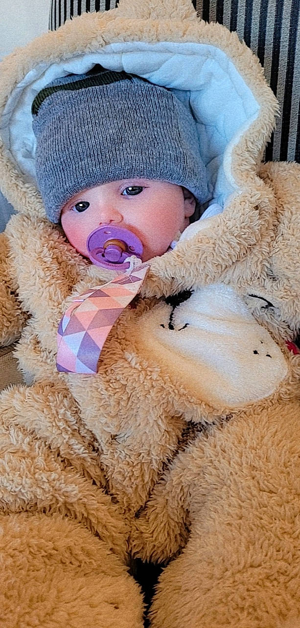Darcy is registered to the contest to win money with this photo: baby, baby_sleeping, baby_toddler_clothing, cap, child, comfort, fur, fur_clothing, headgear, headwear, knit_cap, linens, outerwear, person, plush, skin, stuffed_toy, textile, toddler, vertebrate