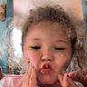 Jaquelyn Marie Kai Wilson joined the competition — help win amazing prizes! casual, child, closeup, cozy, curly_hair, cute, expression, face, flower_filter, fun, hands, indoor, kissy_face, nail_polish, person, pink_shirt, playful, portrait, smiling, young_child