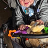 baby, casual, child, clothing, colorful, comfort, cute, drool, face, hands, happy, hoodie, indoor, infant, play, plush, seatbelt, smiling, stroller, toy