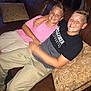 boys, smiling, couch, leather, pink_shirt, black_shirt, khaki_pants, cushion, home_interior, friendship, happy, casual_clothing, indoor, portrait, child, sitting, arm_around, short_hair, relaxed, young