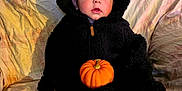 Atticus joined the competition — help win amazing prizes! autumn, baby, bear, black, blanket, child, costume, couch, cozy, cute, face, fall, holiday, hood, indoor, plaid, pumpkin, sitting, soft_lighting, toy