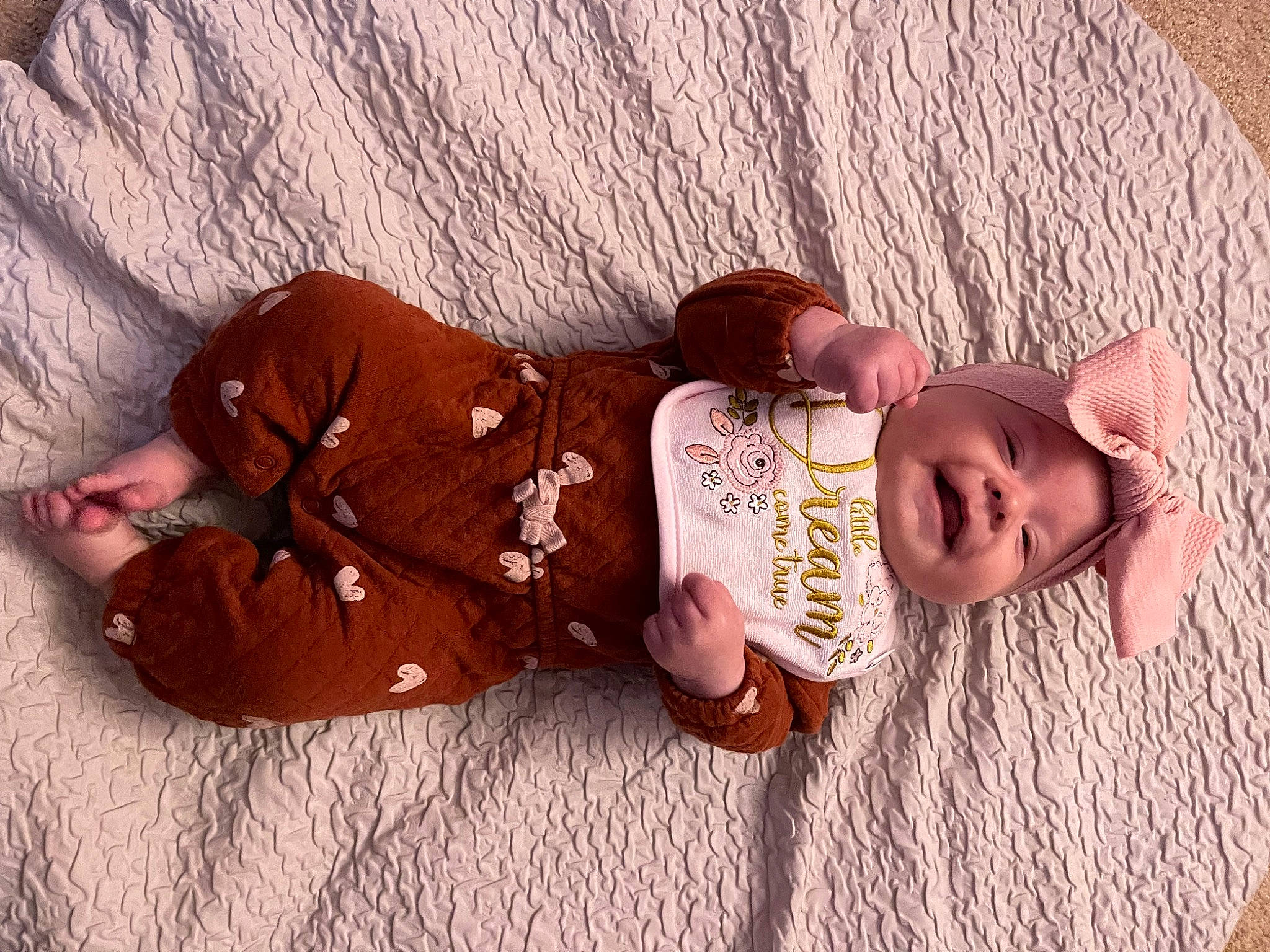 Jolene joined the competition — help win amazing prizes! baby, baby_products, baby_toddler_clothing, brown, cheek, child, comfort, flooring, hand, headgear, human_body, leg, linens, mammal, person, sitting, skin, textile, toddler, vertebrate