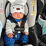 Erick joined the competition — help win amazing prizes! baby, infant, car_seat, hat, pom_pom, safety_harness, buckle, blue_outfit, white_shoes, beige_hat, cute, portrait, hands, seat_canopy, warning_label, car_interior, seat_padding, close_up, window_light, young_child