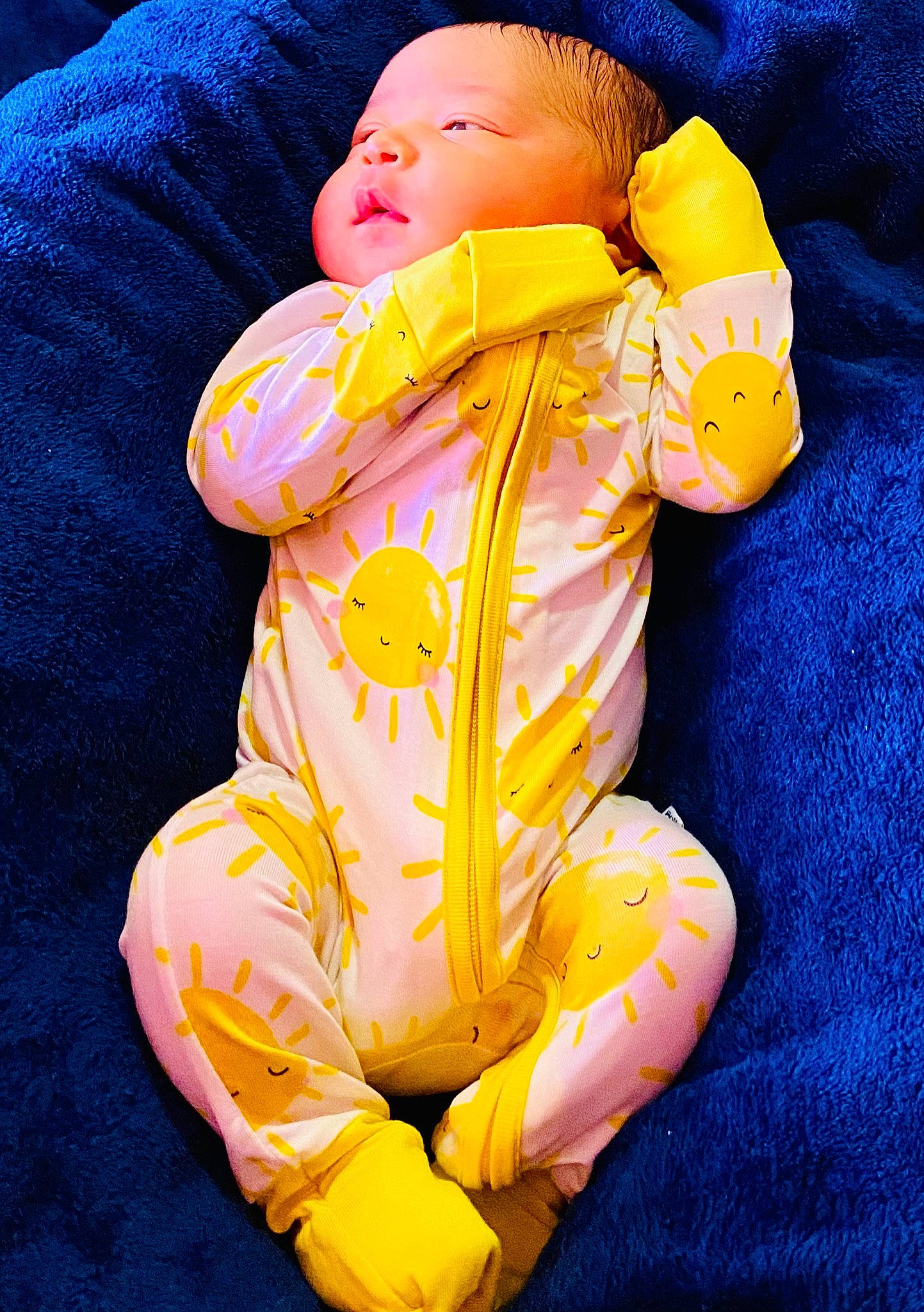 Kaliah is registered to the contest to win money with this photo: abdomen, baby, baby_products, baby_sleeping, baby_toddler_clothing, barefoot, bedtime, blue, child, comfort, electric_blue, head, human_body, linens, orange, peach, person, sitting, sleeve, thumb