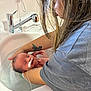 arm, baby, bath, caregiver, closeup, hair, healthcare, hospital, indoor, infant, medical_tube, newborn, peaceful, person, sink, skin, support, tattoo, tub, water