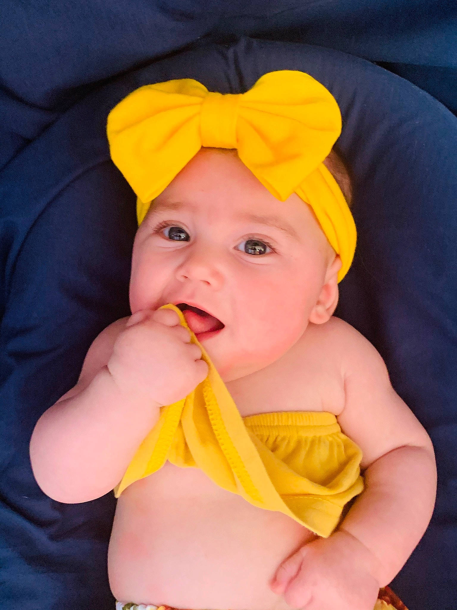 Joy participe au concours pour gagner de l'argent avec cette photo : baby, cheek, child, eye, face, finger, head, headgear, headwear, lip, mouth, neck, person, photography, skin, toddler, yellow