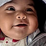 baby, infant, child, smiling, portrait, close_up, face, hood, hoodie, clothing, gray, white, indoor, seated, happy, cute, camera, looking_at_camera, soft_lighting, baby_portrait