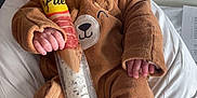 Rafaël participe au concours pour gagner de l'argent avec cette photo : baby, sleeping, onesie, bear_costume, infant, bed, hospital_bed, food_packaging, sausage, packaged_food, hand, face, cute, cozy, resting, indoors, clothing, newborn, peaceful, soft_fabric