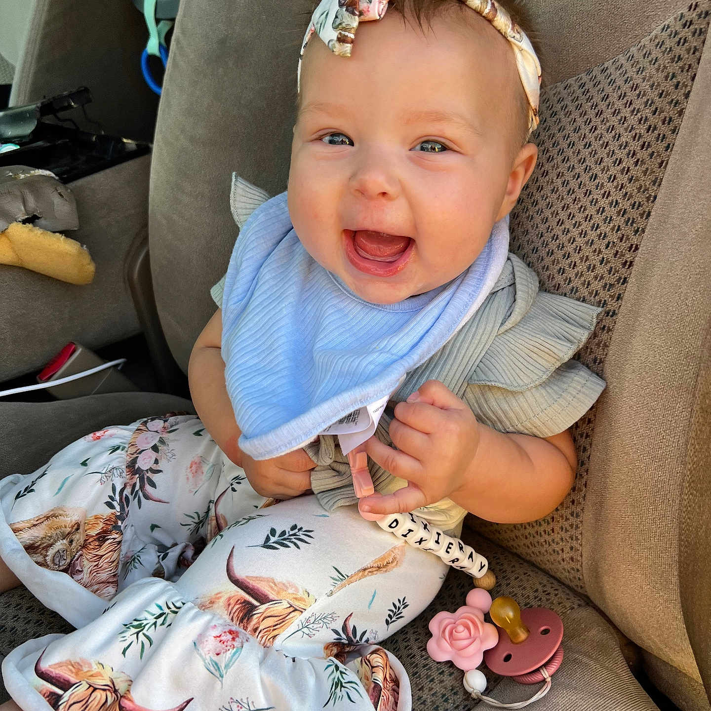 Dixieray joined the competition — help win amazing prizes! accessory, baby, car_seat, child, closeup, clothing, comfort, cute, fabric, happy, headband, indoors, infant, pacifier, patterned_pants, person, seat, smiling, toy, young_child