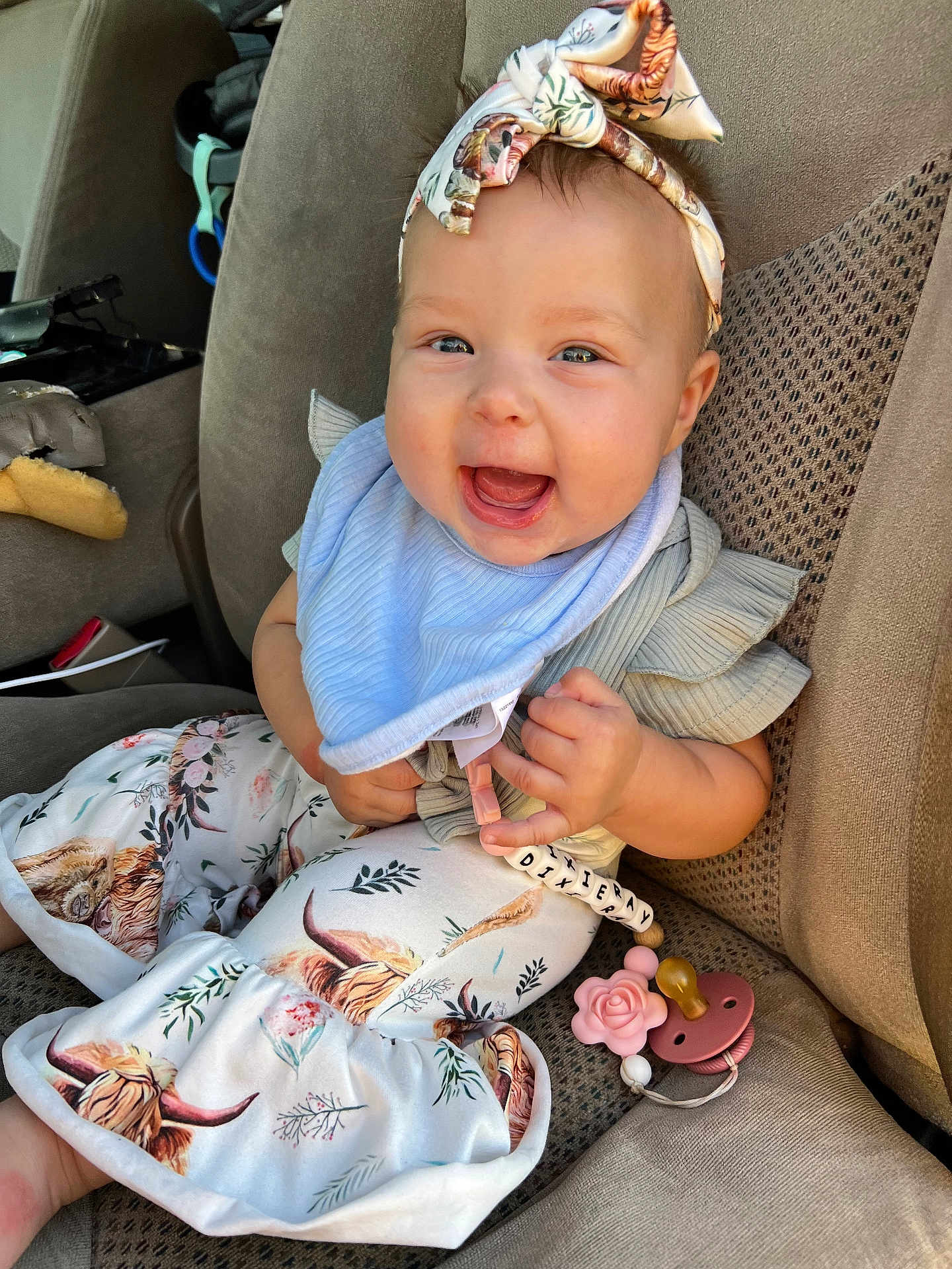 Dixieray joined the competition — help win amazing prizes! baby, child, smiling, headband, car_seat, clothing, patterned_pants, pacifier, toy, seat, happy, infant, cute, person, accessory, fabric, closeup, indoors, comfort, young_child