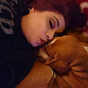 Barkley is registered to the contest to win money with this photo: affection, bond, brown_dog, closeup, comfort, companion, cozy, cuddle, dog, face, indoor, love, patterned_background, person, pet, portrait, resting, sleepy, snuggling, warm_lighting