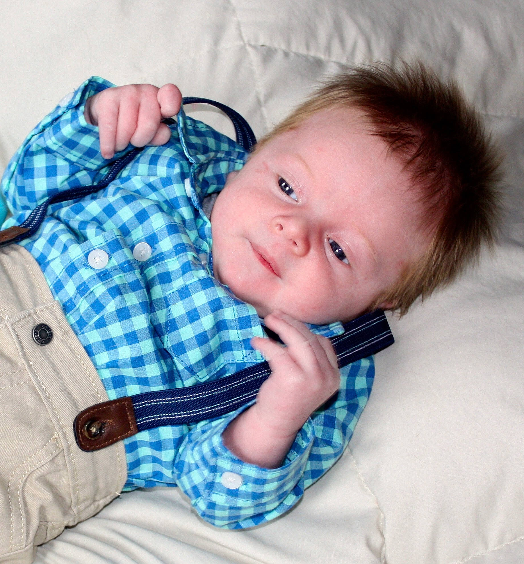 Aidyn is registered to the contest to win money with this photo: baby, baby_products, cheek, child, design, ear, face, head, nose, outerwear, pattern, person, plaid, product, skin, textile, toddler