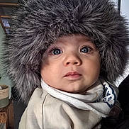 Victory a rejoint le concours — aidez-le/la à gagner de superbes lots ! adorable, baby, blue_eyes, child, closeup, clothing, cute, expression, face, fashion, fur_hat, headwear, indoor, infant, looking_up, person, portrait, soft_light, warm, winter_wear