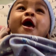 Zhakari joined the competition — help win amazing prizes! baby, infant, face, smile, hat, blanket, clothing, closeup, child, cute, happy, indoors, person, portrait, warm, soft, expression, young, headwear, cozy